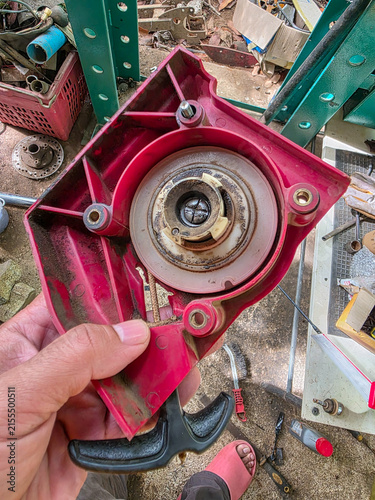 Obraz na plátne Red plastic recoil starter housing with pull handle and metal pulley assembly sh