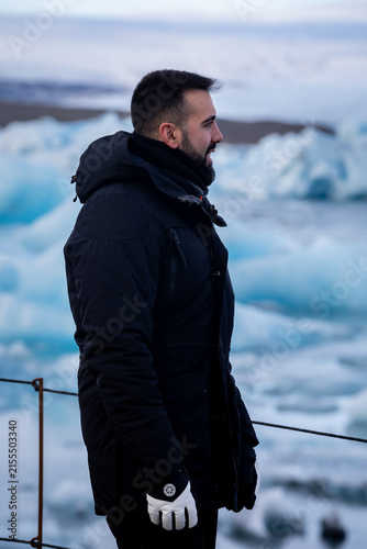 Side Profile Medium Shot of Bearded Man at Jökulsárlón Glacier Lagoon