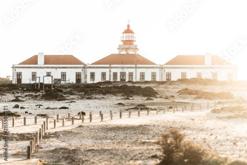Canvastavla Coastal lighthouse station with white buildings and red roofs on windswept sandy