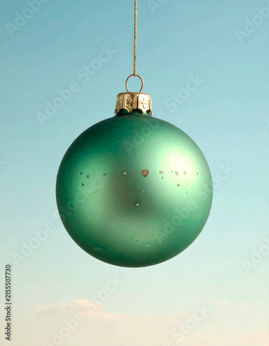 Green Christmas Bauble on Soft Teal Gradient Background