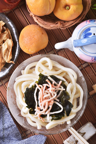 Cold udon noodles in glass bowl   