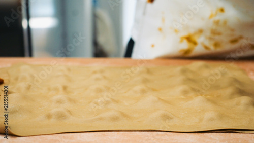 фотографія Vegan pumpkin tortellini being prepared in a professional kitchen setting