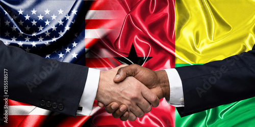 Obraz na płótnie Handshake between the United States and Guinea Bissau, international friendship, background with flags