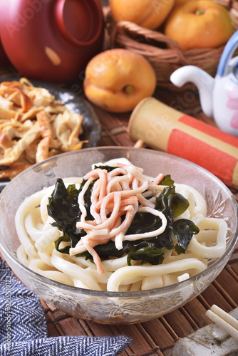 Cold udon noodles in glass bowl   