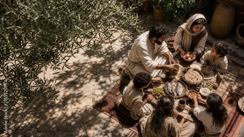 Biblical family sharing bread, fish, eggs, and fruit beneath an olive tree. Ancient Middle Eastern meal symbolizing daily provision, fellowship, hospitality, and the teaching of prayer.
