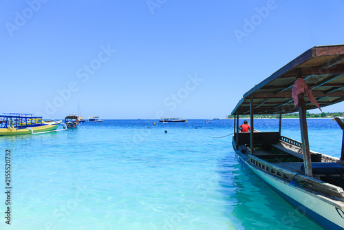 Traditional Wooden Boats on Turquoise Water at Gili Trawangan Beach Lombok
