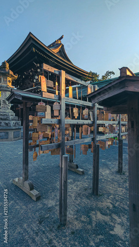 Bild auf Leinwand Wooden prayer plaques Ema hanging at traditional Japanese Shinto shrine