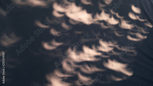 Dynamic Solar Eclipse Light and Shadow Play