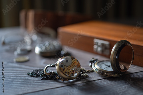 Quadro su tela composition of vintage watch with glass lid and mechanic watches on the old grey