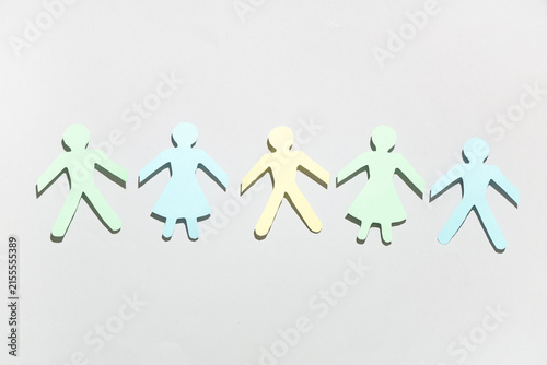 Paper human figures on grey background