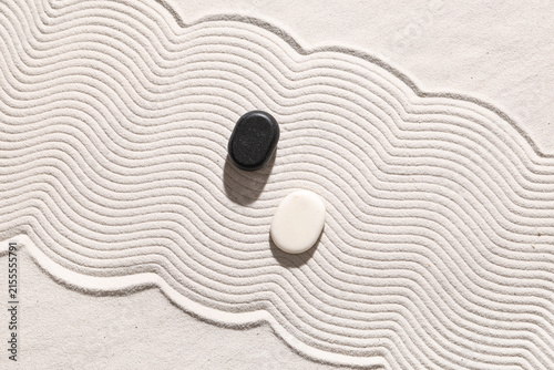 Canvas Print Stones on white sand with lines. Yin Yang concept