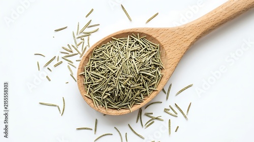 Dried rosemary leaves in a wooden spoon isolated on white background