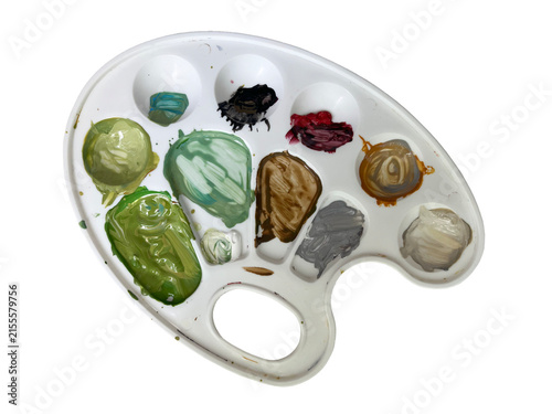 A palette with paints. Gray, brown, green. Isolated on a white background.