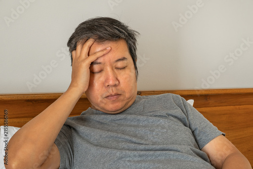 Quadro su tela Dizziness vertigo medical symptom showing a patient resting with fatigue and imbalance due to blood pressure issues, reflecting healthcare and treatment concepts in a clinical context