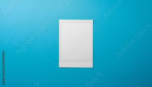 Blank Vintage Polaroid Photo with White Border on Vibrant Blue Background, Minimalist Retro Photography Mockup with Glossy Finish