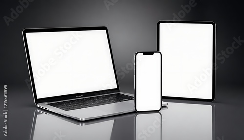 Modern Laptop Tablet and Smartphone with Blank White Screens on Reflective Surface