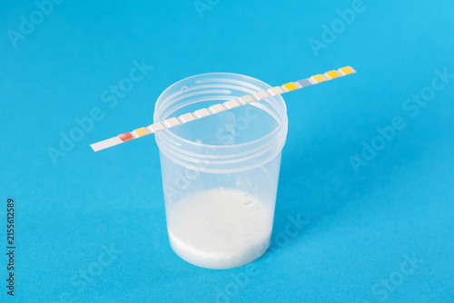 Canvas Print Test strips next to ejaculate analysis on a blue background, concept of measurin