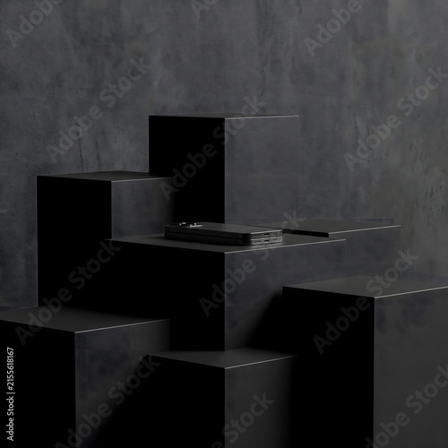 Black product display podium holds small electronic device against dark textured concrete wall.
