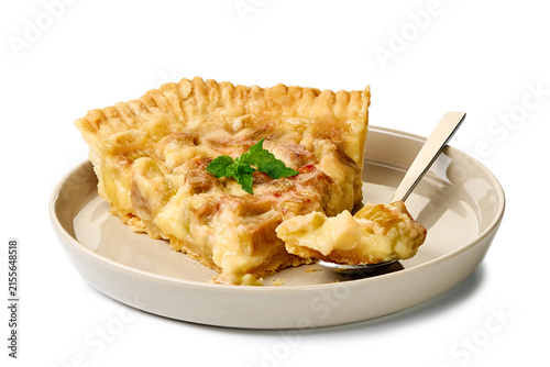 a delicious pie slice served on a plate with a fork, inviting and warm in an indoor setting with beige and brown tones, top-down perspective, food photography, culinary content, baked dough.