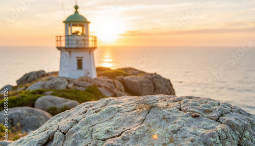 Seascape with a lighthouse on a cliff at sunset