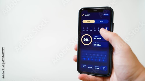 Hand holding smartphone with sleep tracking app in dark mode on white background