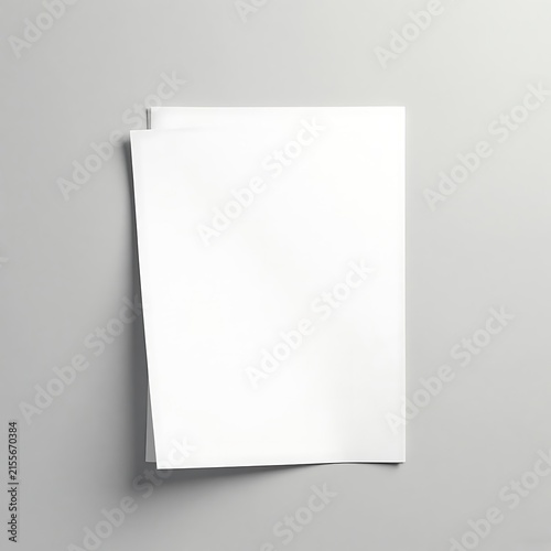 Minimalist stack of white paper sheets on a light gray surface with blank pages.