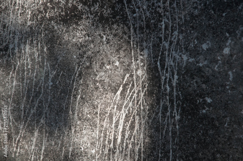 The texture of the stone. The surface of the stone is gray.