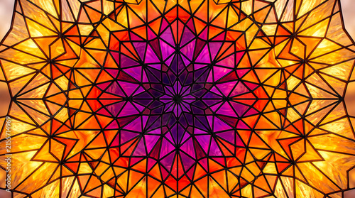 Geometric diamond lattice art stained glass background with vibrant purple and orange hues and patte