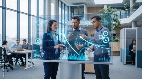 Corporate team analyzing futuristic holographic data charts and graphs in modern office, business strategy meeting, financial growth planning, digital transformation technology