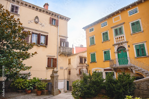 Scenic views of old town Labin in Istria, Croatia. Historic stone houses, tiled roofs, church facade, cozy narrow streets,