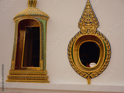 Detailed architectural elements of historic Mazu Shrine in Bangkok. Beautiful Chinese wood carvings, painted decorations, and traditional temple details stand under daylight.
