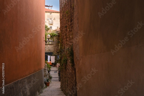 Scenic views of old town Labin in Istria, Croatia. Historic stone houses, tiled roofs, church facade, cozy narrow streets,