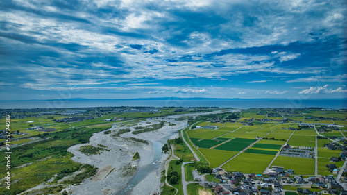 Photography お盆の時期の黒部川扇状地から見える富山湾や洋上風力発電風車や北アルプスなどの様子