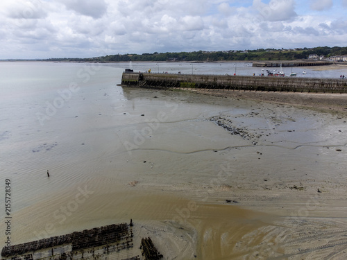 Fotografie Aerial drone view of Cancale promenade and boats during low tide in Brittany, wi