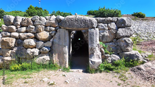 The exterior exit portal of the famous Yerkapı postern tunnel emerges beneath stone walls at ancient Hattusa, Turkey.