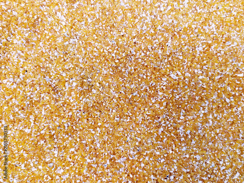 Yellow Corn Grits or Cornmeal Texture Background Top View