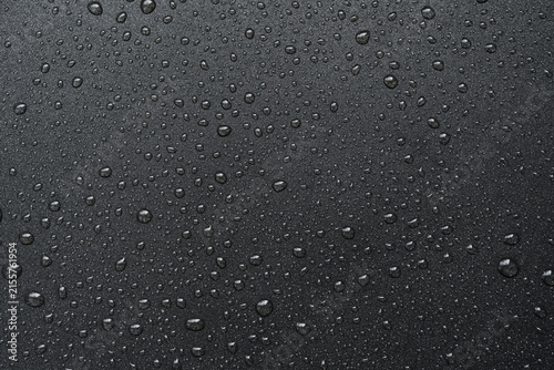 фотографія Oil drops on frying pan texture, water splash pattern on black non-stick coating
