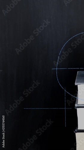 Apple on top of a pile of books and mathematical equations and graphs