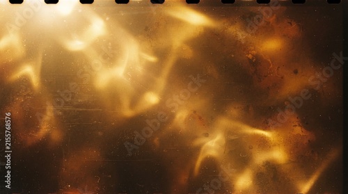 Abstract golden light leaks on dark vintage film texture with dust and scratches for retro photography