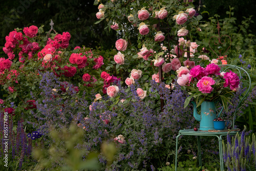Peonies Bouquet in Vintage pitcher in the rose garden