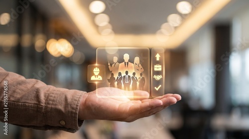 Human Resources Management Concept with Businessman Hand Showing Digital Team Icons and HR Network Interface