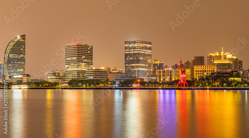 Modern urban architecture, road traffic, and Huangpu River night view in Lujiazui, Pudong, Shanghai, China	