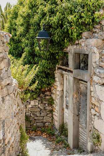 Stone Alley in Ulcinj Old Town with Ivy Lantern