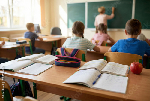 Peaceful Classroom With Students Studying Carefully As Instructor Writes On Board