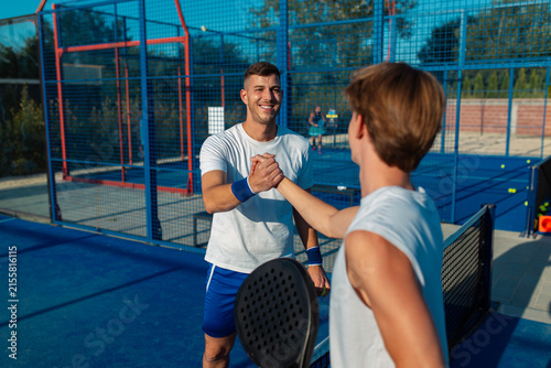 Photography Padel players shaking hands showing good sportsmanship