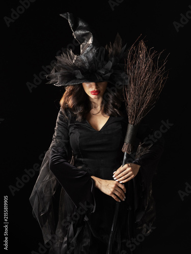 Beautiful witch in black Halloween hat