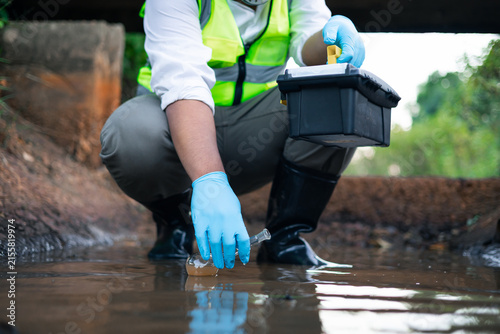 Принти на полотні Scientists collecting water samples collected from the canal in test tubes sampl