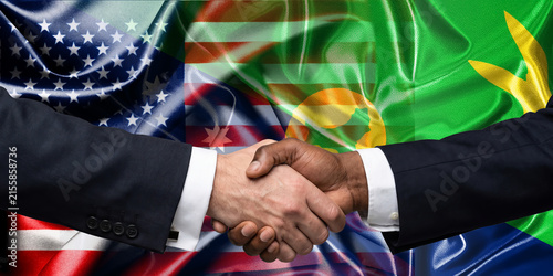 Handshake between the United States and the Christmas Island, international friendship, background with flags. Flags.