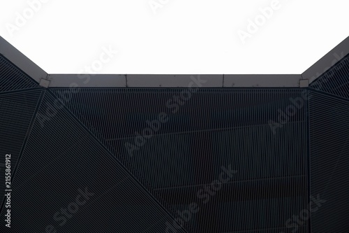 Abstract architectural background with dark geometric slatted ceiling panels and isolated white copy space on top