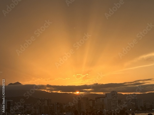 Bild auf Leinwand Solar eclipse dramatic sunset with crepuscular rays over Mediterranean coastal c